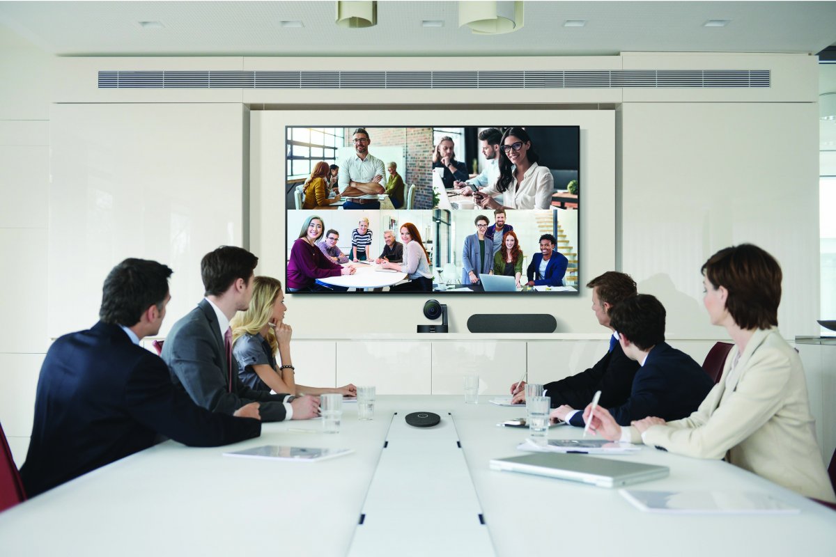 Board room of employees meet remotely on the 65
