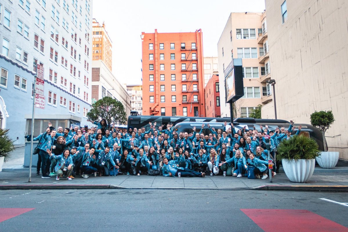 The Traction on Demand team posing across the street.