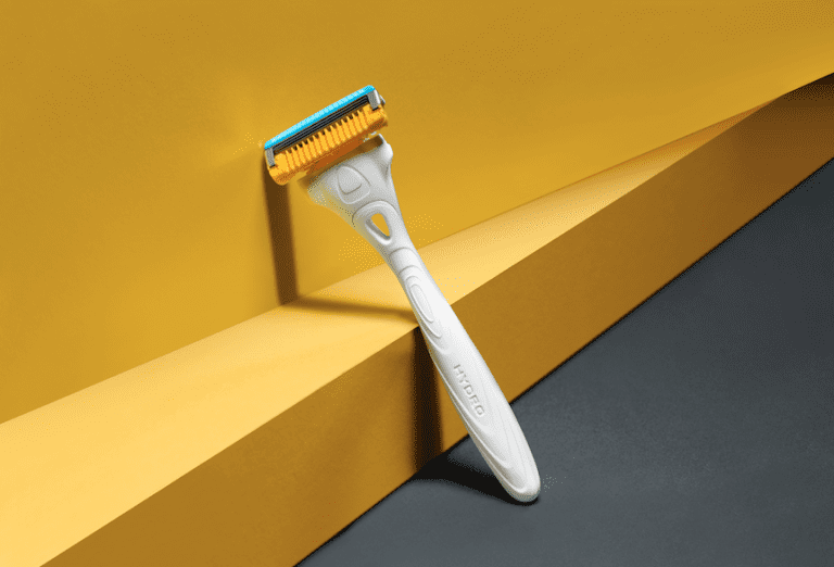 Schick razor against yellow wall