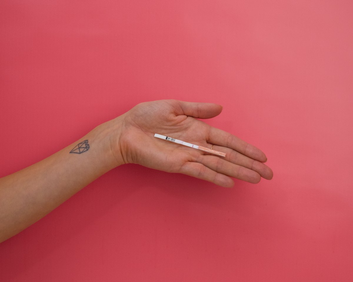 hand holding an OVRY test strip