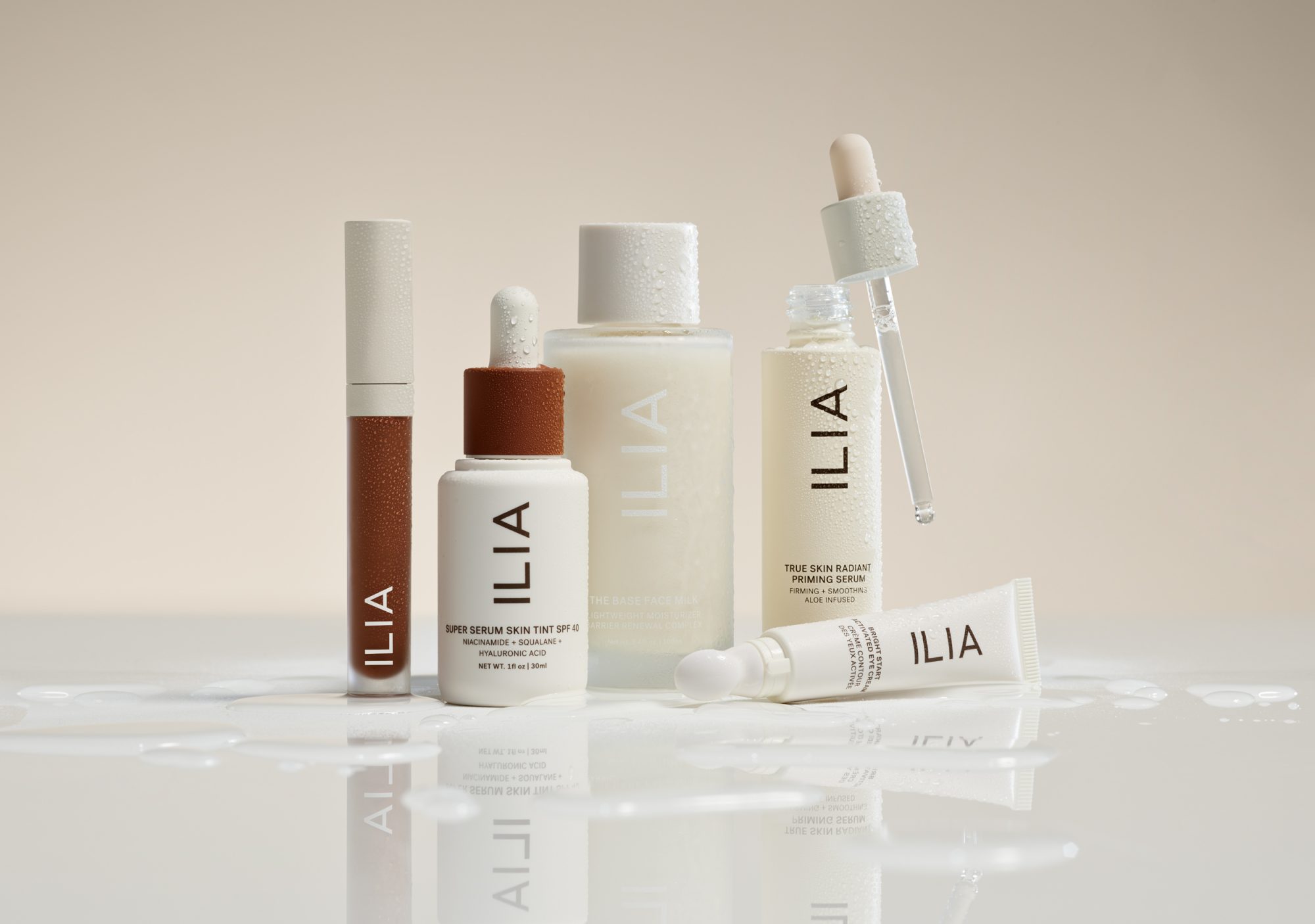 Lineup of various ILIA Beauty products.